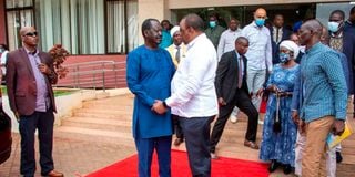 Azimio la Umoja Coalition flag bearer Raila Odinga with President Uhuru Kenyatta.